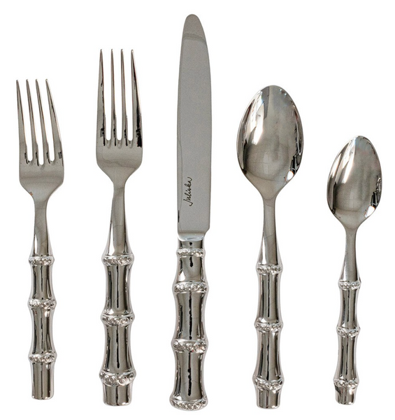 The Juliska Bamboo 5 Piece Flatware Set, Polished by Juliska highlights five stainless steel utensils adorned with bamboo-patterned handles, comprising two forks, a knife, a spoon, and a teaspoon.