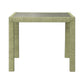The Isla Game Table in Sage by Made Goods features a square design with a green textured finish and four straight legs, inspired by tropical rattan palms, displayed on a plain white background.
