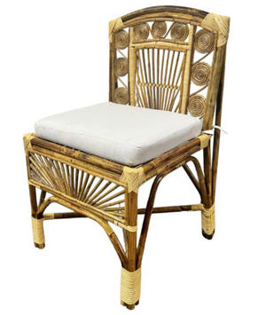 The Robinson Chair from the Varnish Collection features intricate woven patterns, a curved backrest, and a white seat cushion for versatile style.