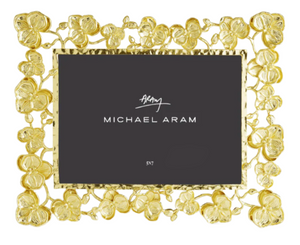 The Michael Aram Gold Orchid Frame, 5x7, adds a touch of luxury to your décor with its elegant floral design.