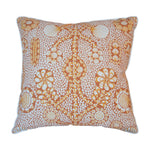 The Burnt Sienna Shell Grotto Outdoor Pillow by Associated Design features an intricate orange and white floral and circular pattern, crafted from premium materials for stylish outdoor décor.