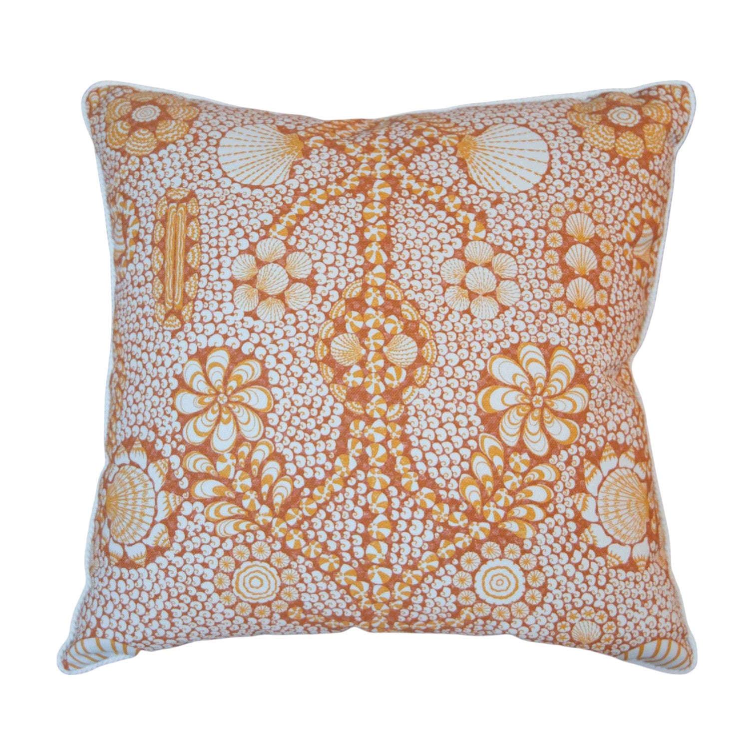 The Burnt Sienna Shell Grotto Outdoor Pillow by Associated Design features an intricate orange and white floral and circular pattern, crafted from premium materials for stylish outdoor décor.