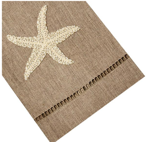Part of the Haute Home Starfish Coaster & Bath Collection, this brown fabric napkin is crafted from premium linen and showcases an embroidered beige starfish design with a row of decorative stitching near the edge—a stylish addition to your home décor.
