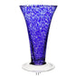 The Vanessa Vase Collection by William Yeoward Crystal features a tall, flared handmade crystal vase in Mediterranean blue with white speckles, clear round base, and 11-inch height.