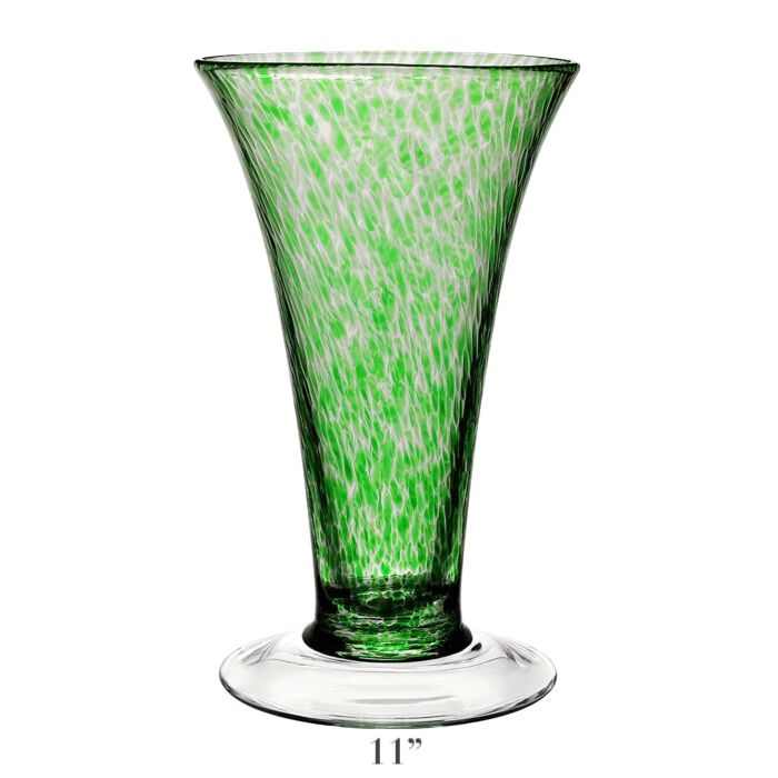 The Vanessa Vase Collection by William Yeoward Crystal features a handmade 11-inch crystal vase with a flared rim, green and white Mediterranean speckled pattern, and clear round base.