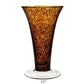 The Vanessa Vase Collection by William Yeoward Crystal features handmade crystal vases with flared rims, mottled amber Mediterranean hues, and clear round bases. Each vase stands 11 inches tall.