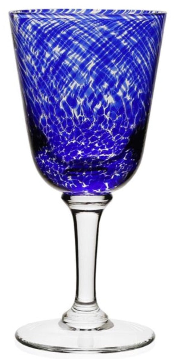 From the William Yeoward Crystal Vanessa Blue Drinkware Collection, this wine glass features a blue and white marbled bowl with an optical illusion effect, clear stem and base, and textured design.