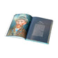 An open Van Gogh book by Penguin Random House shows a painted portrait of Vincent van Gogh on the left page and a chapter called "Paris: The quest for light" with text on the right.