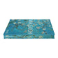 The "Van Gogh" art book by Penguin Random House lies flat, featuring a cover with a blossoming almond tree against a blue background.
