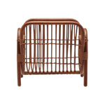 A front-facing view of a wooden rattan chair with curved armrests and an open weave, ideal alongside the Makassar Magazine Holder in walnut rattan by Pigeon & Poodle to elevate your natural décor.