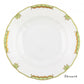 The Herend Princess Victoria Green Collection features a round white porcelain plate with a scalloped edge, hand-painted green and gold ornamental border, and "Dessert" in black—an homage to Queen Victoria’s elegant style.