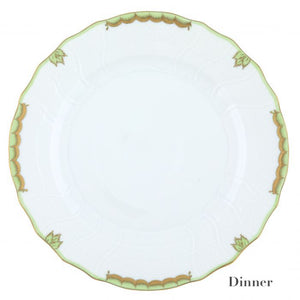 White ceramic dinner plate, part of the Herend Princess Victoria Green Collection, features a green and gold scalloped border reminiscent of intricate hand-painted designs from Herend porcelain.