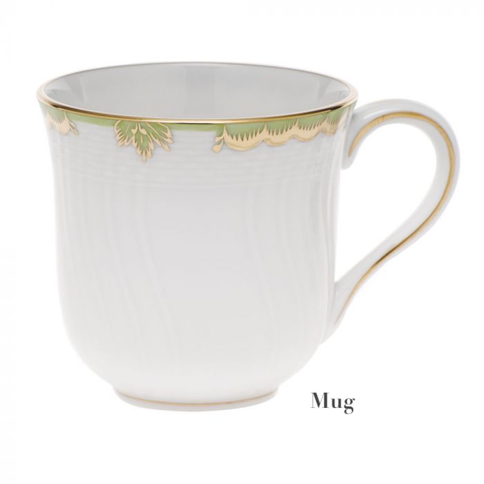 A Herend Princess Victoria Green Collection porcelain mug features gold and green accents on its rim and handle, evoking Victorian elegance. The mug is displayed against a white background with "Mug" in the lower right corner.