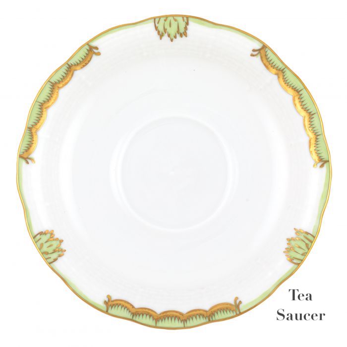 The Herend Princess Victoria Green Collection features a white porcelain tea saucer with hand-painted designs and intricate green and gold scalloped edges. "Tea Saucer" text appears on the right, reminiscent of elegant Herend porcelain.