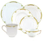 The Herend Princess Victoria Green Collection features fine porcelain china, including two plates, a saucer, a teacup, and a mug with hand-painted green and gold designs on white.