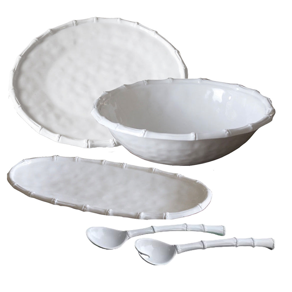 The Beatriz Ball Vida White Bamboo Serveware Collection features a large plate, bowl, oval platter, and two spoons with bamboo-like rims—versatile white ceramic pieces perfect for stylish dining.