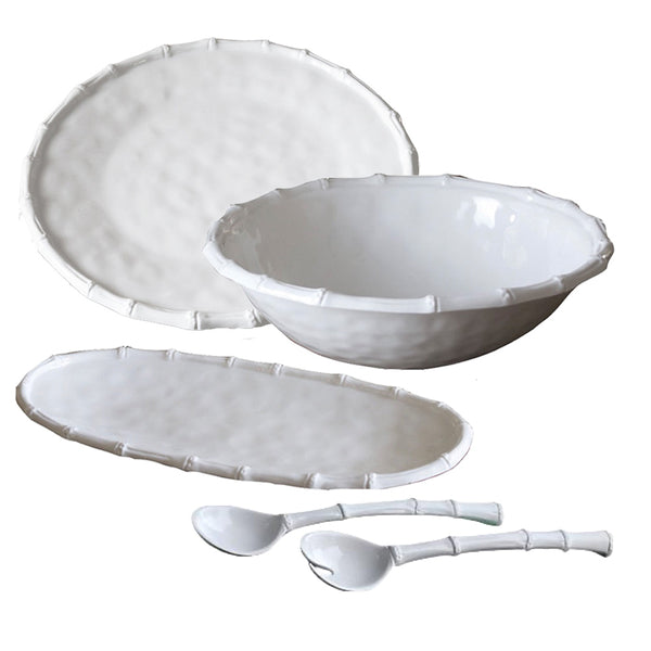 The Beatriz Ball VIDA White Bamboo Serving Collection by Beatriz Ball features a luxurious melamine dinnerware set that includes a round bowl, an oval plate, a rectangular platter, and two spoons, all with a textured bamboo-like rim design. Ideal for indoor or outdoor use and conveniently dishwasher safe.