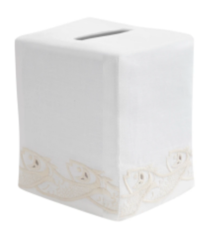 The Scrollfish Tissue Box Cover by Haute Home is an ivory tissue box cover crafted from luxurious Italian linen, featuring a delicate hand-embroidered leaf pattern at the bottom.