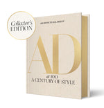 A beige hardcover "Architectural Digest at 100: Collector’s Edition" by Abrams, featuring iconic interiors and a gold "Collector's Edition" badge in the top left corner.