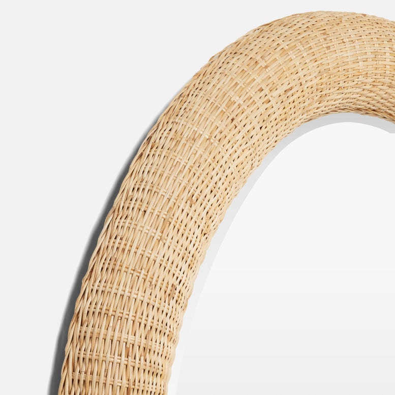 Close-up of the Yuri Rattan Mirror by Made Goods, showcasing its round handwoven wicker frame and bringing natural rattan decor charm to any space.