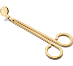 The Aerin Lou Wick Trimmer features a brass finish, two finger loops, and angled blades—perfect for precise candle care.