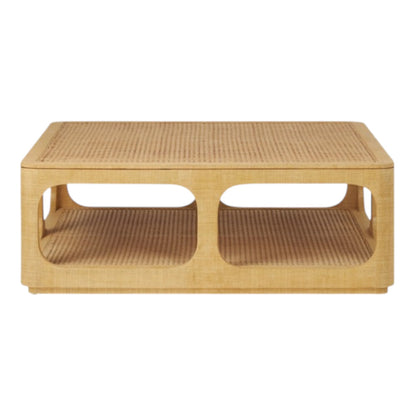The Fiorenza Coffee Table by Made Goods features a natural wood finish, raffia and cane woven top, open sides, and a lower shelf for storage.