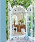 Cover of the book “Beautiful” by Rizzoli, featuring an open doorway that reveals a stylish, sun-drenched living room adorned with classic décor and lush greenery above—a striking example of American-style interiors and the seamless indoor/outdoor lifestyle of California.