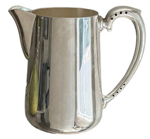 The Hôtel Silver Vintage Pitcher with Perforated Handles, featuring a reflective finish and large handle with spout, is shown on a white background.
