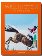 The orange cover of "Wellington: The World of Horses" by Assouline features a horse and rider leaping over an obstacle, capturing the excitement of Wellington, Florida’s famed equestrian shows.