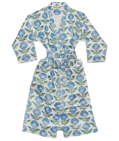 Sure! Here’s the revised sentence using your product data: The Kaavia Robe by John Robshaw is a white mashru silk cotton robe with long sleeves and a belt, adorned with blue floral and green leaf motifs inspired by Jaipur’s iconic floral block print.