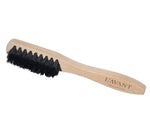 L’Avant Collective Laundry Stain Brush with a wooden handle and stiff black bristles.