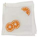 Set of 4 Orange Slice Coasters by Haute Home, designed with exquisite hand-embroidered patterns featuring an orange slice delicately placed in the corner and two artfully overlapping at the bottom.