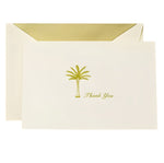 The Crane Thank You Palm Tree Folded Card Set features cream-colored engraved cards with a gold palm tree and text, nestled in matching envelopes with gold lining—the ideal palm tree stationery.