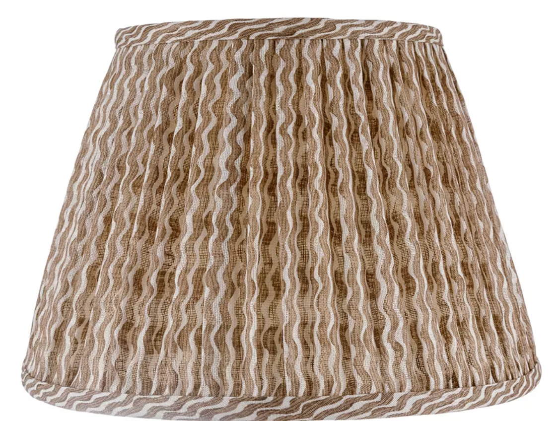 The John Rosselli Fermoie Popple Nut Brown Lampshade is a linen Empire gathered shade with a tapered shape and beige wavy stripes.
