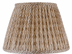 The John Rosselli Fermoie Popple Nut Brown Lampshade is a linen Empire gathered shade with a tapered shape and beige wavy stripes.