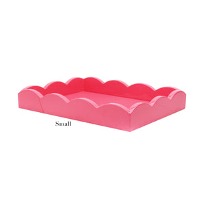 The Scalloped Watermelon Pink Lacquer Tray from Addison Ross is a small, rectangular tray with scalloped edges, displayed against a white background.