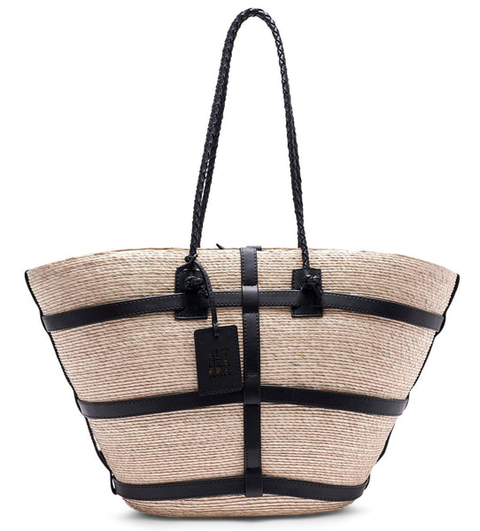 Woven palm leaf Altuzarra Watermill Bag with black leather straps and accents, featuring a small black logo tag, isolated on a white background.