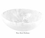 This medium bowl from the White Resin Serveware Collection by Nashi Home features a white marble pattern, smooth curved edges, and is labeled "Wave Bowl Medium" on the underside.