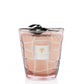 A Baobab Waves Malibu Candle in a clear glass holder with a decorative web pattern and a black ribbon, infused with a floral perfume.
