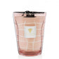 A pink Baobab Waves Malibu candle in a clear glass vessel with a white grid design and logo on the front, transformed into a decorative candle.