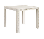 The Mr & Mrs Howard Amy Game Table is a white square table featuring decorative geometric patterns on its edges and legs, ideal for enhancing your game nights. Shown against a plain white background.