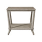 The Hickory Chair Rye Rectangular Side Table features a weathered stone finish, angled legs, and a lower shelf, combining timeless function with contemporary style.