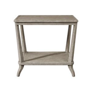 The Hickory Chair Rye Rectangular Side Table features a weathered stone finish, angled legs, and a lower shelf, combining timeless function with contemporary style.