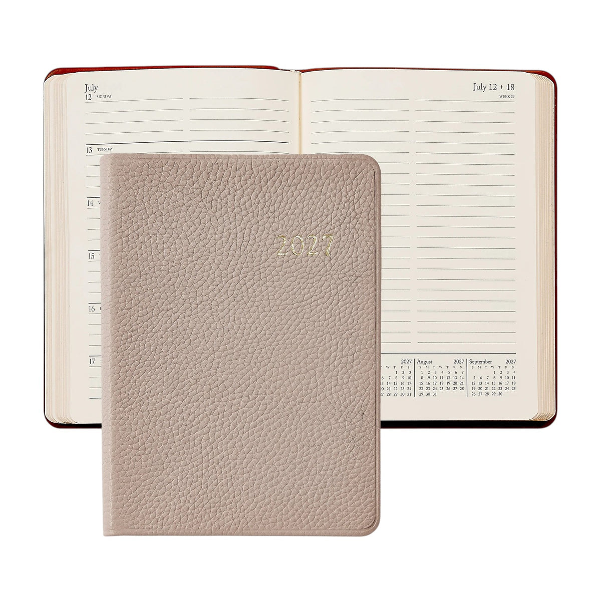 A beige leather Graphic Image 2027 Weekly Notebook with a textured cover rests atop an open weekly planner displaying dates from July 12 to July 18, evoking the timeless elegance of a classic appointment book.