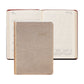 The image features a closed 2027 Weekly Notebook by Graphic Image in gold, positioned in front of an open planner displaying a week in July. Both planners have lined pages, calendar layouts, and distinctive red-edged covers—ideal for use as an appointment book or a stylish leather notebook.