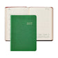 A closed 2027 Weekly Notebook by Graphic Image in green, styled like a sleek leather notebook, is displayed in front of an open weekly appointment book showing dates from July 12 to July 18.