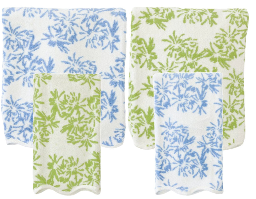 Two towels with blue floral patterns and two with green, all featuring a charming scallop trim, are part of the Weezie Towels x Meg Braff Bath Collection. This set from Weezie Towels perfectly captures Palm Beach’s spirited essence.