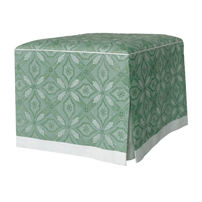 A rectangular Cocktail Ottoman by Hickory Chair, elegantly upholstered in a green and white fabric with geometric and star motifs, exuding the precise, Made To Measure refinement reminiscent of a dressmaker’s skirt.