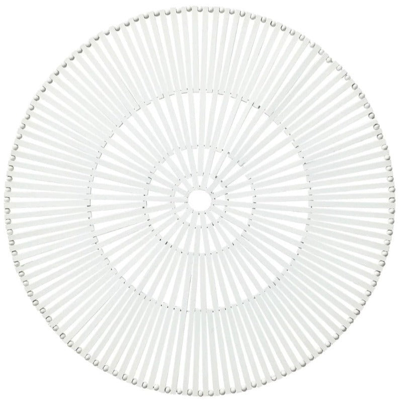 The Kim Seybert Spoke Placemat is a white bamboo placemat with radiating slats and a central hole, arranged in a modern geometric pattern for an organic look.
