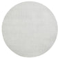 The Kim Seybert Saigon Placemat is a round, light gray swatch with a subtle woven texture inspired by Vietnamese plaiting, shown on a plain white background.